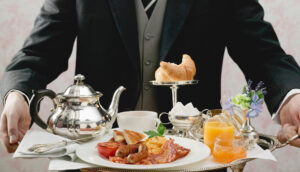butler serving english breakfast on tray . image shot 2007. exact date unknown.